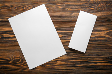 Empty sheets of paper on wooden table