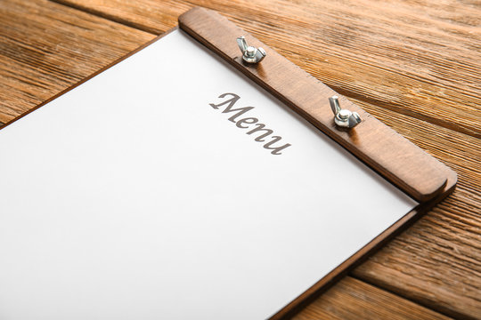 Blank menu on wooden table