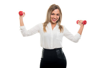 Portrait of beautiful business woman holding two dumbbells and smiling