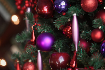 Winter decoration. decoration of the shelf for the new year or Christmas. candles, Christmas tree, books, bows and bumps