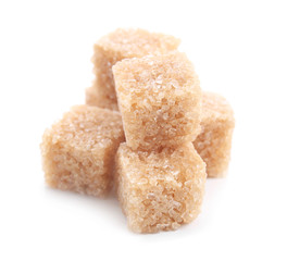 Brown sugar cubes on white background