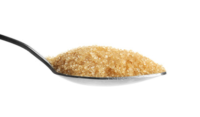 Spoon with brown sugar on white background