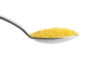 Spoon with color sugar on white background