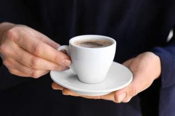 Woman with cup of tasty aromatic coffee, closeup