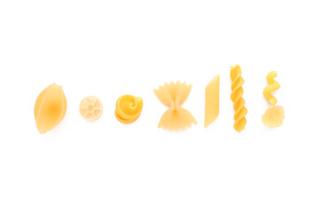 Various uncooked pasta on white background