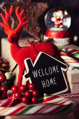 christmas ornaments and text welcome home