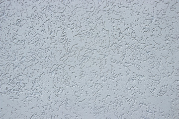 The texture of the plaster is "bark beetle" on the wall. Seamless texture.