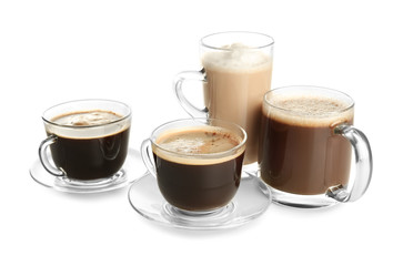 Glass cups with tasty aromatic coffee on white background