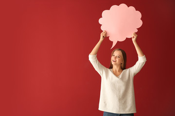 Young woman with blank speech bubble on color background