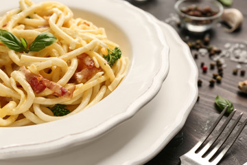 Plate with delicious pasta carbonara, closeup