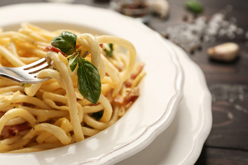 Plate with delicious pasta carbonara, closeup