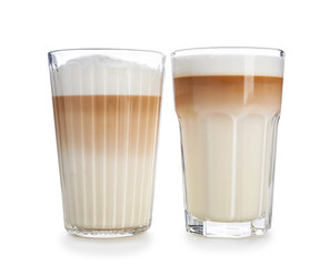 Glasses of tasty aromatic latte on white background
