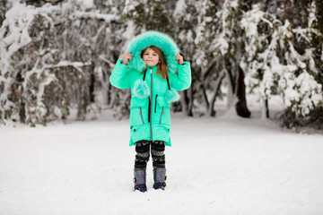 Beautiful portrait of little child enjoying winter