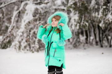 Beautiful portrait of little child enjoying winter