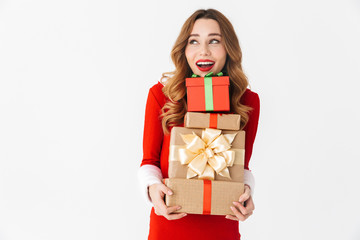 Beautiful emotional woman in christmas costume holding present gift box.