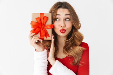 Beautiful emotional woman in christmas costume holding present gift box.