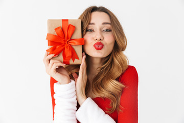 Fototapeta premium Beautiful emotional woman in christmas costume holding present gift box.