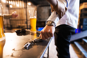 Close up of man taking car keys.