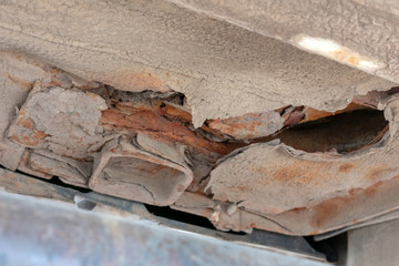 Corrosion on old car. Rust on bottom.