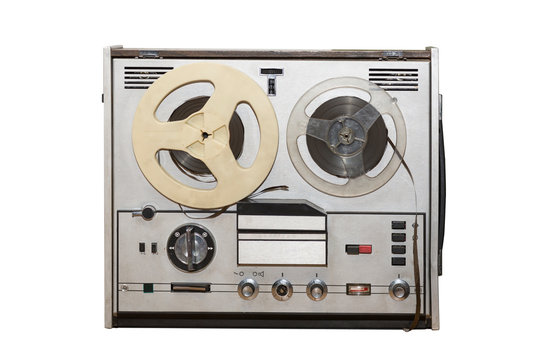 Analog vintage stereo reel tape deck recorder player with metallic reels isolated on white background.