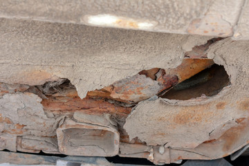 Fototapeta premium Corrosion on old car. Rust on bottom.