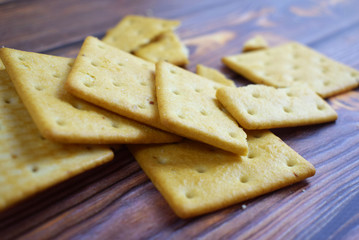 Delicious crumbly cracker on wooden background.Cookies for tea.