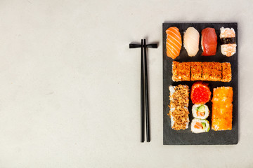 Flat-lay of sushi set, space for text
