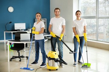 Fototapeta na wymiar Team of janitors in office