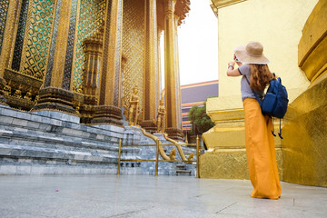 Beautiful Asian tourists visiting Wat Phra Kaew.