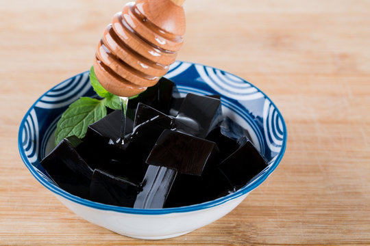 Guilinggao with honey, a traditional Chinese Herb-Made Dessert.