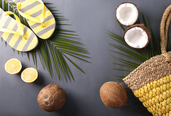 Fototapeta na wymiar Composition with coconuts and beach accessories on color background