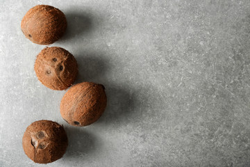 Ripe coconuts on grey background