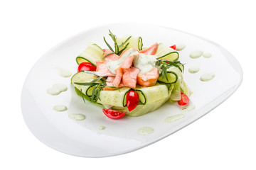 Salad with smoked salmon and cucumber. On white background.