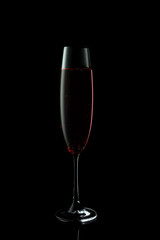 Glass of rose champagne on dark background