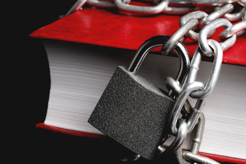part of the red book which has a chain connected to the chain hanging lock