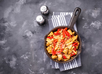 Pasta with chicken and pepper in tomato sauce