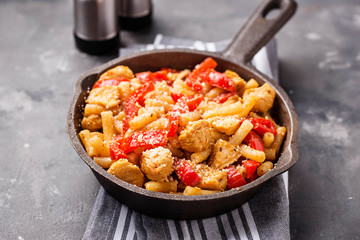 Pasta with chicken and pepper in tomato sauce