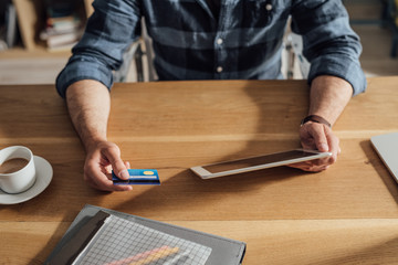 A Man Using Credit Card