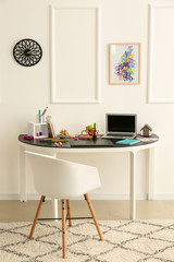 Stylish workplace of designer with modern laptop