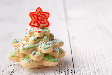 Pine tree Christmas cookies with festive decoration with copy space