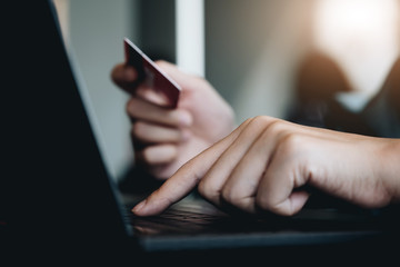 Online payment,Man's hands holding smartphone and using credit card for online shopping. Cyber Monday Concept