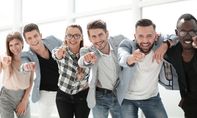 Group of people pointing at the camera and smiling - isolated