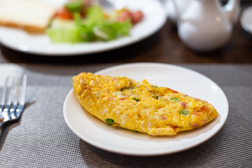 breakfast omelette, scrambled eggs on Table