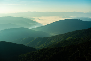 Foggy on the mountain at sunset.