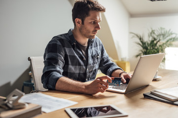 A Man Using Credit Card