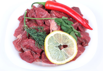 Beef raw piece of pork on plate