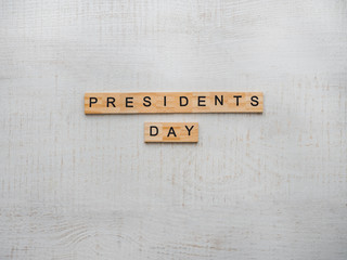 Presidents' Day. Beautiful greeting card. White, isolated background, close-up, top view, wooden surface. Congratulations for loved ones, relatives, friends and colleagues
