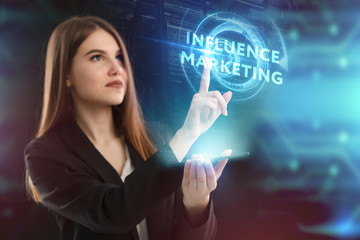 The concept of business, technology, the Internet and the network. A young entrepreneur working on a virtual screen of the future and sees the inscription: Influence marketing