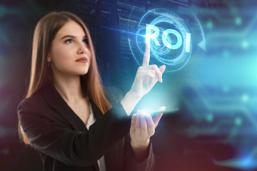 The concept of business, technology, the Internet and the network. A young entrepreneur working on a virtual screen of the future and sees the inscription: ROI
