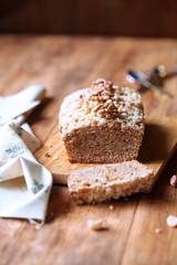 Walnut Financier - traditional French cake - with Crumble Topping,  on wooden table. 
